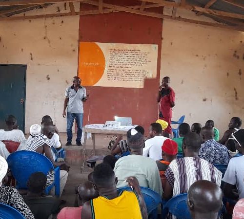 RESOURCE PERSON MAKING PRESENTATION IN DUU-EAST IN THE SISSILA EAST ON GCX STANDARDS